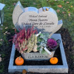 E080 in light grey granite, custom dimensions. Polished flower border, bronze sparrows, and recessed black-painted engraving.