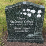 E009 in green-gray granite in customized dimensions. Intarsia plus text that is recessed and painted antique white.