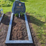 E078 in labrador granite. Polished grave frame, porcelain photograph, recessed gilded inscription.